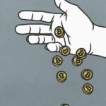 a hand dropping a handful of coins representing bitcoin tokens
