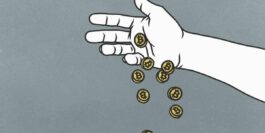 a hand dropping a handful of coins representing bitcoin tokens