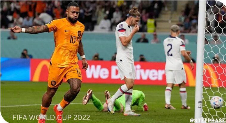 Memphis Depay celebrates after scoring the opening goal of his team during the World Cup round of 16 match between the Netherlands and the United States, at the Khalifa International Stadium in Doha, Qatar, Saturday, Dec. 3, 2022. (AP Photo/Martin Meissner)