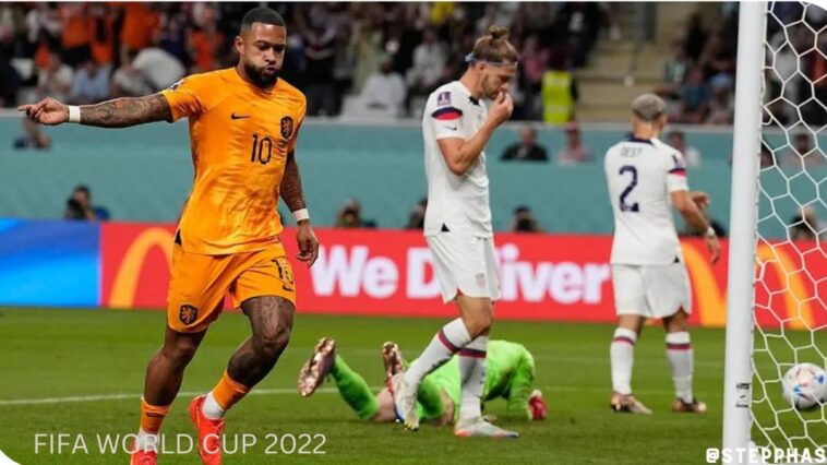 Memphis Depay celebrates after scoring the opening goal of his team during the World Cup round of 16 match between the Netherlands and the United States, at the Khalifa International Stadium in Doha, Qatar, Saturday, Dec. 3, 2022. (AP Photo/Martin Meissner)