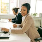 Friendly customer support team working in a bright, modern office.