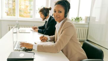 Friendly customer support team working in a bright, modern office.