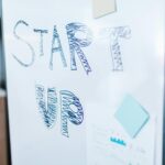 Creative startup concept handwritten on a whiteboard, symbolizing innovation in business.