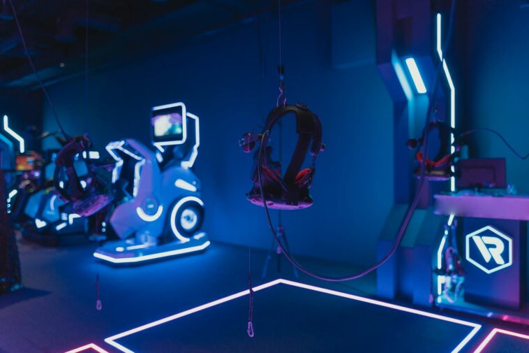 Immersive VR gaming setup with neon lights showcasing advanced technology.