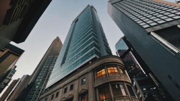 Stunning view of Hong Kong Island skyscrapers at dusk with a low-angle perspective.