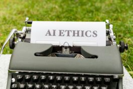 A vintage typewriter outdoors displaying "AI ethics" on paper, symbolizing tradition meets technology.