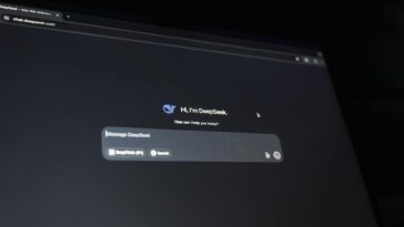 A dark-themed chat interface displaying an AI assistant conversation starter on a screen.