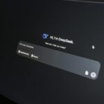 Close-up of DeepSeek AI chat interface on a laptop screen in low light.