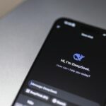 Close-up of smartphone screen showing DeepSeek AI chatbot interface on a modern device.