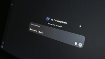 Close-up of DeepSeek AI chat interface on a laptop screen in low light.