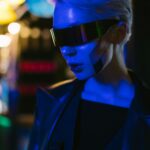 A futuristic cyber woman with AI-inspired eyewear under neon lights, exuding a cyberpunk style.