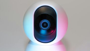 Futuristic IP security camera in soft lighting, perfect for modern smart home setups.