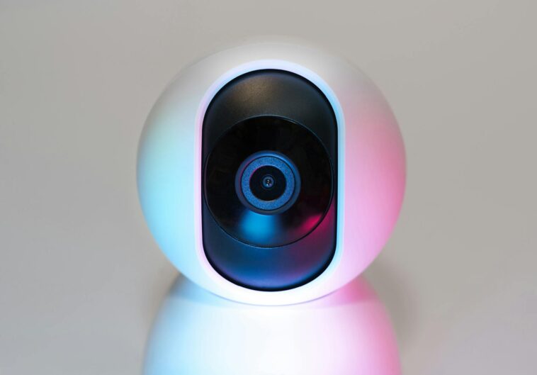 Futuristic IP security camera in soft lighting, perfect for modern smart home setups.