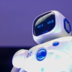 A modern humanoid robot with digital face and luminescent screen, symbolizing innovation in technology.