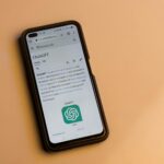 A smartphone displaying the Wikipedia page for ChatGPT, illustrating its technology interface.